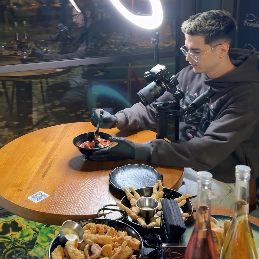 Cosmin filming branded food content with a gimbal and ring light